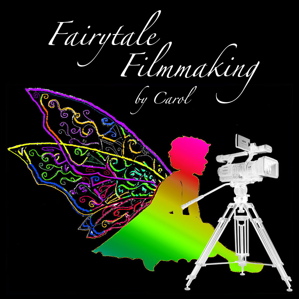 Colorwing fairy with rainbow wings beside a video camera on a tripod